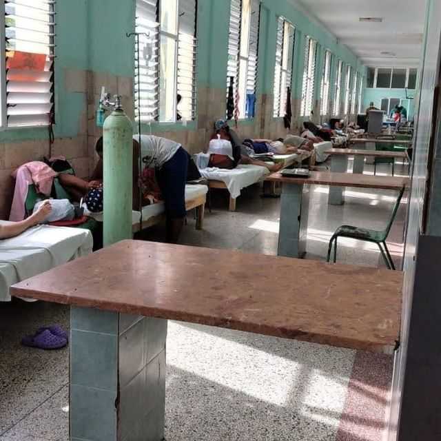 a collapsed hospital in Cuba with patients in the hallways